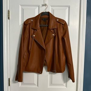 Camel colored “leather” jacket.